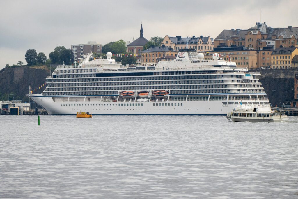 A Viking cruise ship at Stockholm harbor, Sweden with scenic city backdrop.